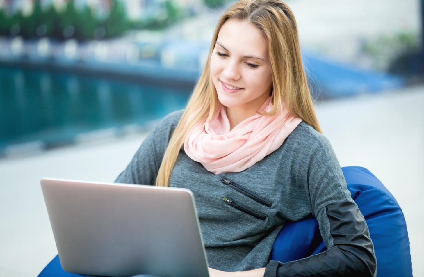 Professional workspace showing content creation process with laptop and planning materials